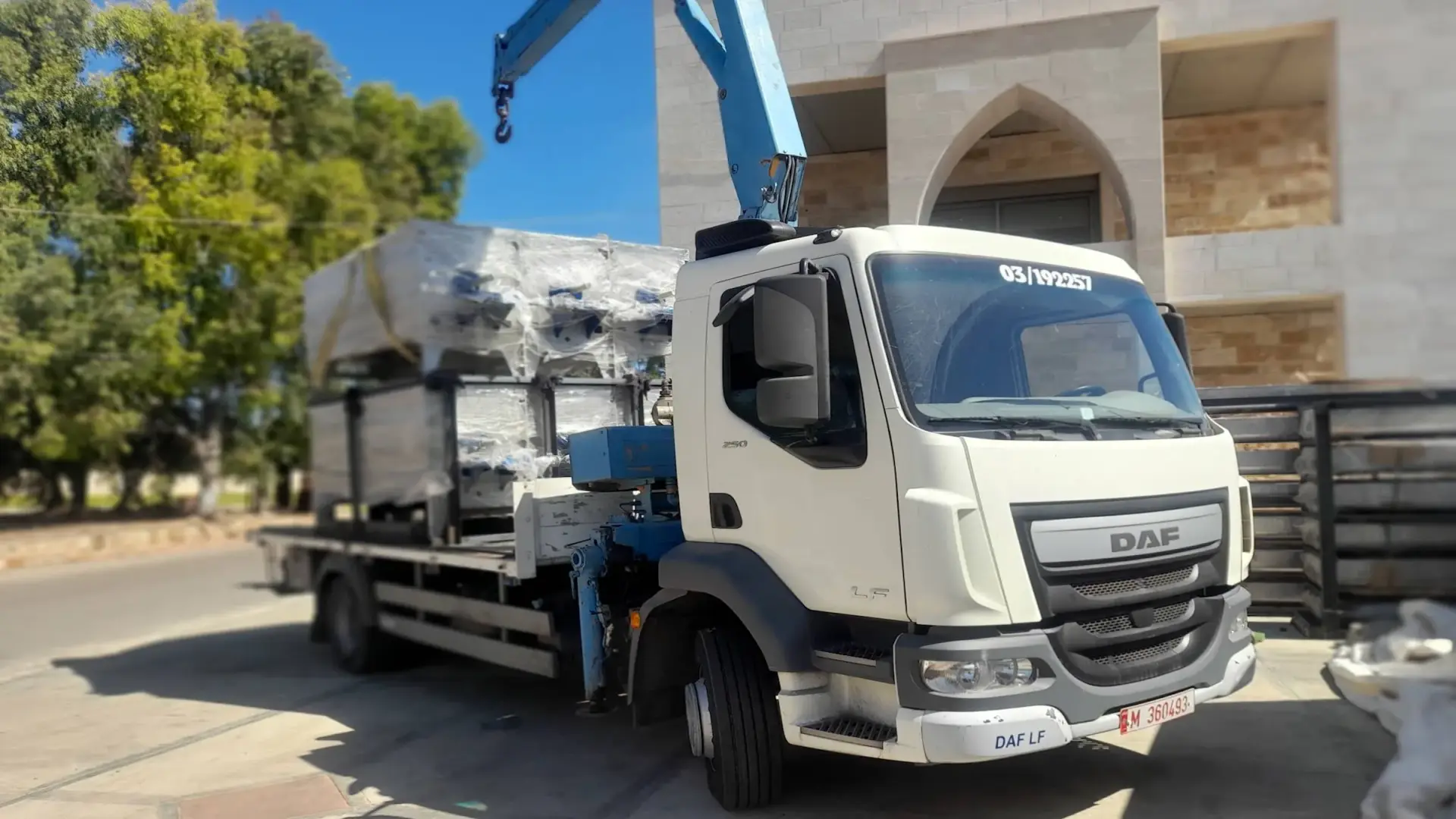 Sayed Transport crane truck loading heavy machinery in Lebanon
