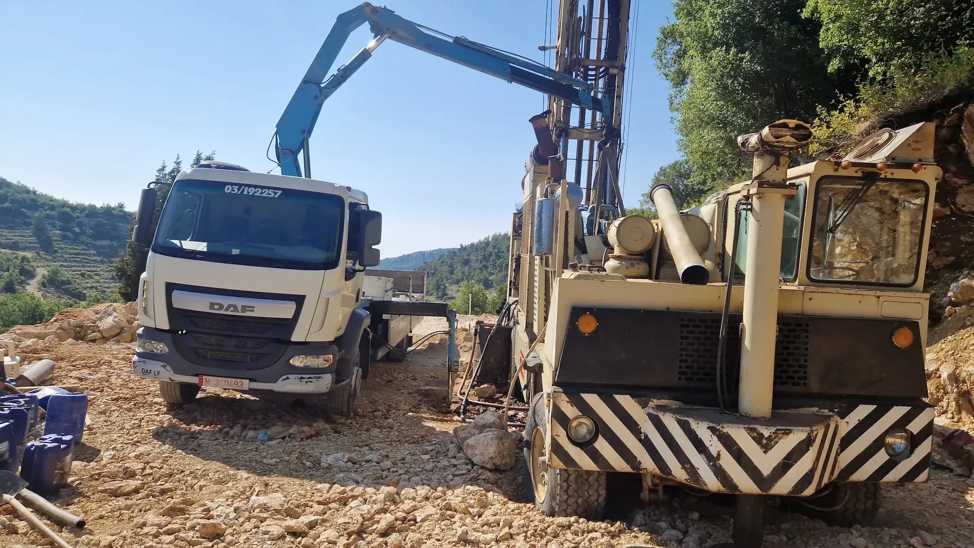 Sayed Transport loading heavy industrial machinery with the truck-mounted crane